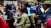 Police officers disperse female opposition lawmakers as they attempt to deliver a petition to the Ministry of Internal Affairs, in Kampala, Uganda, April 27, 2023.