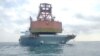 马来西亚海事当局发布照片显示，因未经允许在马来西亚水域下锚非法停泊的一艘中国登记的货船被马来西亚当局扣押。(2023年5月29日）