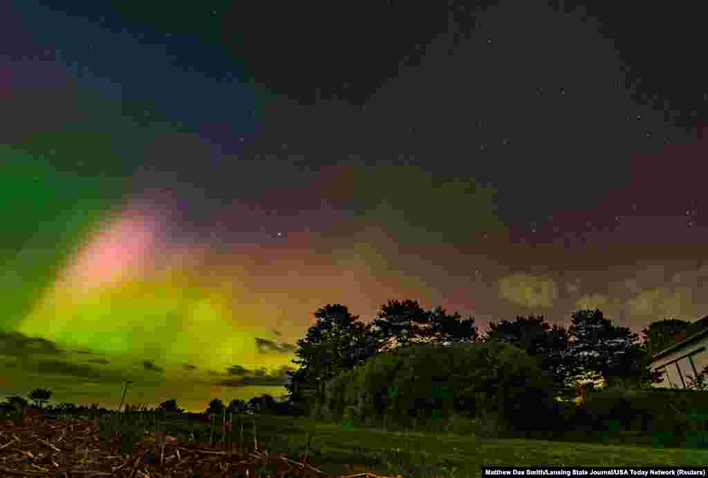 The Northen Lights, or aurora borealis, illuminate the sky in Alaiedon Township, Michigan, March 10, 2024.