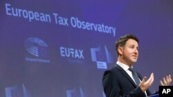 FILE - French economist Gabriel Zucman speaks during a media conference of the European Tax Observatory at EU headquarters in Brussels, June 1, 2021.