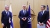 NATO Secretary General Jens Stoltenberg, center, speaks after Finnish Foreign Minister Pekka Haavisto, left, handed over his nation's accession documents to U.S. Secretary of State Antony Blinken at NATO headquarters in Brussels, April 4, 2023.