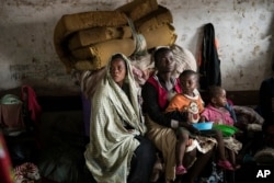 Mothers and their children at a displacement center in Blantyre, Malawi, March 14, 2023.