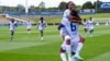 Melchie Dumonay selebre premye gol li ak Roselord Borgella pandan match kalifikasyon pou Mondyal FIFA a nan vil Auckland, La Nouvel Zeland, 22 Fevriye, 2023. 