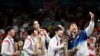 Bronze medalists S. Korea's Lim Jonghoon takes a selfie with: gold medalists China's Wang Chuqin and China's Sun Yingsha, silver medalists N. Korea's Ri Jong Sik, and N. Korea's Kim Kum Yong and bronze medalist Shin Yubin, July 30, 2024. 