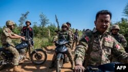 This photo taken on December 10, 2023 shows members of the Mandalay Peoples Defense Forces (MDY-PDF) heading to the frontline. (AFP)