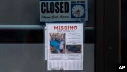 A missing person flyer for Joseph "Lomsey" Lara is posted on the door of a business in a shopping mall in Lahaina, Hawaii, Aug. 21, 2023. Wildfires devastated parts of the Hawaiian island of Maui earlier this month.