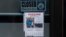 A missing person flyer for Joseph "Lomsey" Lara is posted on the door of a business in a shopping mall in Lahaina, Hawaii, Aug. 21, 2023. Wildfires devastated parts of the Hawaiian island of Maui earlier this month.