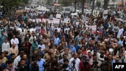 Traders shout slogans during a protest at a street in Karachi, Aug. 23, 2023, against the surge in petrol and electricity prices as Pakistan endures soaring inflation. 