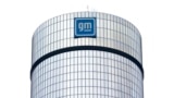 FILE - A General Motors logo is seen on a building, April 24, 2024, in Detroit. 