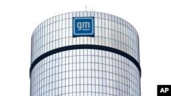 FILE - A General Motors logo is seen on a building, April 24, 2024, in Detroit. 