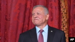 FILE - Jordan's King Abdullah II poses for photos on June 19, 2023. The King approved a bill on Aug. 12, 2023, to punish online speech deemed harmful to national unity, according to the Jordanian state news agency.