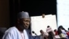 The Chairman of Independent National Electoral Commission, Yakubu Mahmood, displays a results sheet to the media during the presentation of final results of Nigeria's General and Presidential election, in Abuja, Feb. 27, 2023,