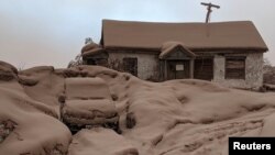 A house and car are seen covered in volcanic dust following the eruption of the Shiveluch volcano in the Kamchatka region of Russia's Far East, April 11, 2023. (Institute of Volcanology and Seismology/Handout via Reuters)