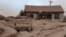 A house and car are seen covered in volcanic dust following the eruption of the Shiveluch volcano in the Kamchatka region of Russia's Far East, April 11, 2023. (Institute of Volcanology and Seismology/Handout via Reuters)