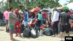 ARCHIVO - Migrantes en la localidad colombiana de Necoclí, uno de los puntos de mayor acogida de población en condición de paso hacia el Darién. Foto tomada en 2021.