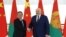 Belarusian President Alexander Lukashenko shakes hands with China's Premier Li Qiang during a meeting in Minsk, Belarus, Aug. 22, 2024, in this photo from the Press Service of the President of the Republic of Belarus.