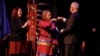 Minnesota Governor Tim Walz fist bumps Lieutenant Governor Peggy Flanagan during the governor's inauguration at the Fitzgerald Theater in St. Paul, Minn., Jan. 7, 2019.