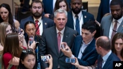 Reporters encircle Speaker of the House Kevin McCarthy as debt limit negotiations continue at the Capitol in Washington, May 25, 2023. McCarthy adjourned the House for the Memorial Day weekend.