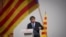 Catalan independence leader and former President Carles Puigdemont addresses supporters after his arrival near the Catalan parliament to attend the investiture debate in Barcelona, Spain, Aug. 8, 2024.