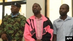 FILE: Self-proclaimed pastor Paul Nthenge Mackenzie (C), who set up the Good News International Church in 2003 and is accused of inciting cult followers to starve to death "to meet Jesus", appears in the dock with other co-accused at the court in Malindi on May 2, 2023.