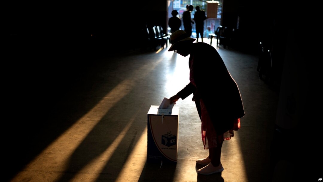A woman casts her ballot at a polling station during general elections in Eshowe, South Africa, May 29, 2024. 