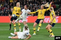 USA's forward #11 Sophia Smith (2L) controls the ball during the Australia and New Zealand 2023 Women's World Cup round of 16 football match between Sweden and USA at Melbourne Rectangular Stadium in Melbourne, Aug. 6, 2023.