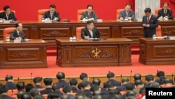 North Korean leader Kim Jong Un speaks at a plenary meeting of the 8th Central Committee of the Workers' Party of Korea, at the party's headquarters in Pyongyang, North Korea, in this photo released Dec. 31, 2023, by the Korean Central News Agency.
