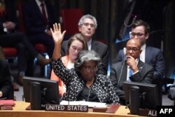 U.S. Ambassador to the United Nations Linda Thomas-Greenfield votes on a resolution regarding the situation in Israel and Gaza at a Security Council meeting on the situation in the Middle East, at the United Nations, Oct. 18, 2023, in New York.
