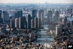 FILE - Tokyo, shown here in 2021, has attracted many middle-class and wealthy Chinese immigrants, pushing up the average price of new central city apartments by nearly 40% since 2022.