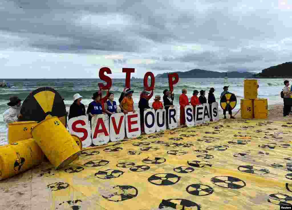 Activists take part in a protest against Japan releasing treated radioactive water from the Fukushima nuclear power plant into the Pacific Ocean, in Busan, South Korea.