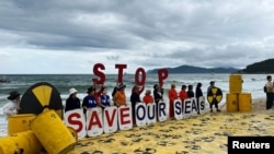 Activists take part in a protest against Japan releasing treated radioactive water from the wrecked Fukushima nuclear power plant into the Pacific Ocean, in Busan, South Korea.