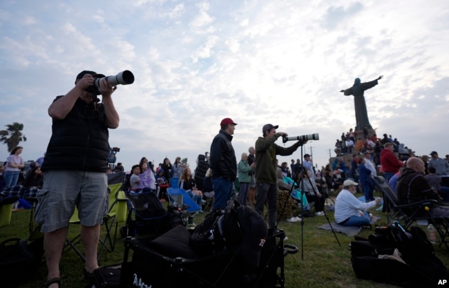 People gather to watch SpaceX's mega rocket Starship launch it's third test flight from Starbase in Boca Chica, Texas, Thursday, March 14, 2024. (AP Photo/Eric Gay)