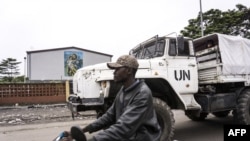 FILE - A United Nations Peacekeepers' truck patrols around Catholic churches during a demonstration on January 21, 2018 in Kinshasa, the Democratic Republic of Congo. 