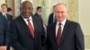 FILE - In this photo provided by Photo host Agency RIA Novosti, Russian President Vladimir Putin, right, and South African President Cyril Ramaphosa pose for a photo during a meeting with a delegation of African leaders and senior officials in St. Petersburg, June 17, 2023.
