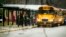 FILE - Students exit a school bus at Richneck Elementary School on Jan. 30, 2023, in Newport News, Va. The mother of a 6-year-old who shot his teacher at the school was sentenced Dec. 15, 2023, to two years in prison for felony child neglect.