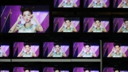 Footages of virtual girl group MAVE is played at the control room of MBC in Seoul, South Korea, February 28, 2023. ( REUTERS/Kim Soo-hyeon)
