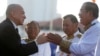 FILE - Cambodia's King Norodom Sihamoni, left, greets Prime Minister Hun Sen at the Independence Monument while attending celebrations marking the 65th anniversary of the country's independence from France, in Phnom Penh, Nov. 9, 2018. 