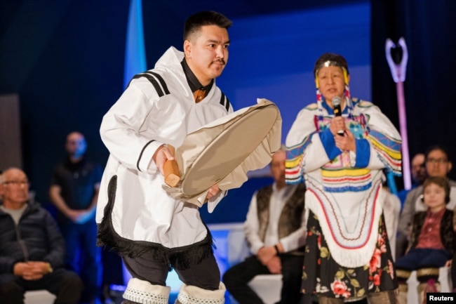 A drummer dances during the Nunavut devolution agreement ceremony at the Aqsarniit Hotel & Conference Centre in Iqaluit, Nunavut, Canada, Jan. 18, 2024.