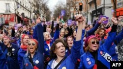 Members of the feminist collective "Les Rosies" participate to a march as part of the International Women's Rights Day, in Paris. 