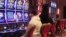 FILE - Gamblers play slot machines at the Hard Rock Casino in Atlantic City, N.J., on May 17, 2023. 