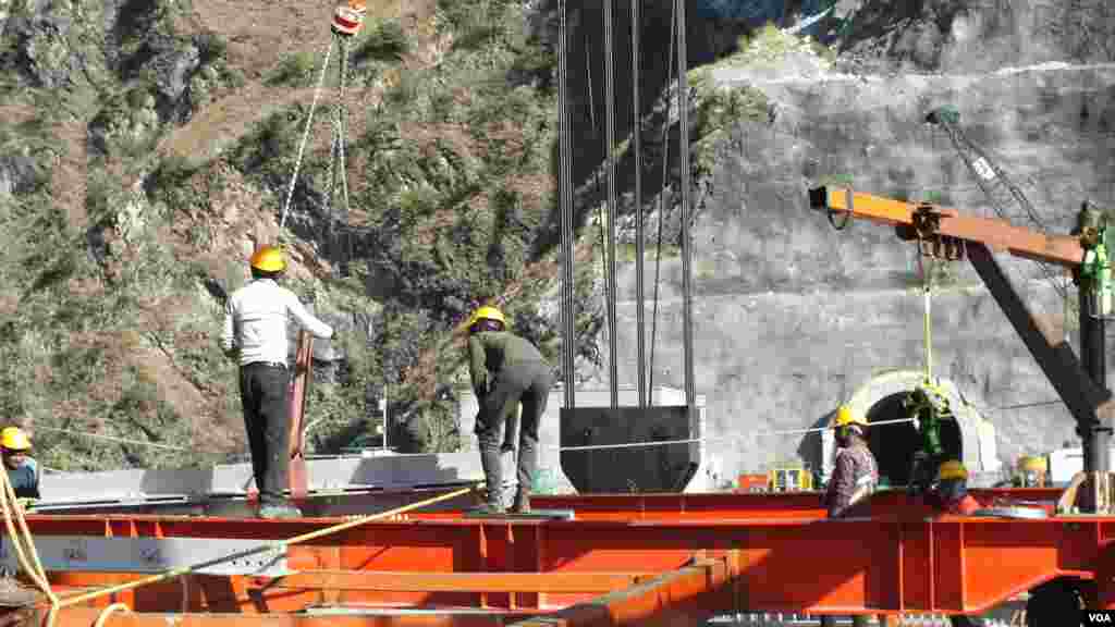 Site engineers at the Anji Khad Bridge, one of the important bridges for the Udhampur-Srinagar-Baramulla Rail Line in Kashmir. (Bilal Hussain/VOA)