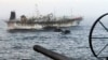 FILE - Handout picture released by Argentina's Navy Press Office showing the ARA "Bouchard" Ocean Patrol escorting a Chinese flag fishing ship after it was caught illegally operating in Argentina's Exclusive Economic Zone, May 4, 2020. 