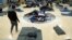 FILE - Migrants rest at a shelter in Denver, Colorado, Jan. 6, 2023. In late 2022, Venezuelans crossing into Texas from Mexico found that Denver in the U.S. state of Colorado was a cheaper bus ride from the border city of El Paso than many of the better-known cities in the U.S.