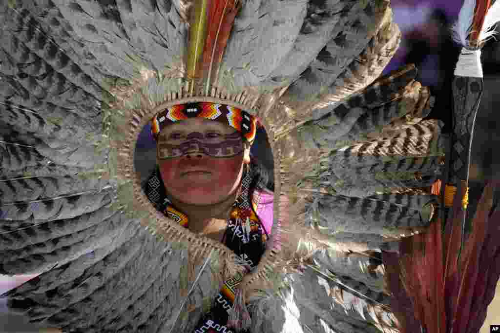 An Indigenous chief joins a march of Indigenous women from across Brazil at the end of a three-day event to strengthen the political role of Indigenous women in Brasilia. &nbsp;(AP Photo/Eraldo Peres)