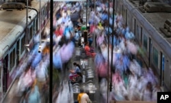 FILE - Churchgate station is seen during peak hours in Mumbai, India, March 20, 2023. India, with over 1.4 billion people, is set to eclipse China to become the largest — and youngest — population in the world.