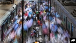 FILE - Churchgate station is seen during peak hours in Mumbai, India, March 20, 2023. India, with over 1.4 billion people, is set to eclipse China to become the largest — and youngest — population in the world.