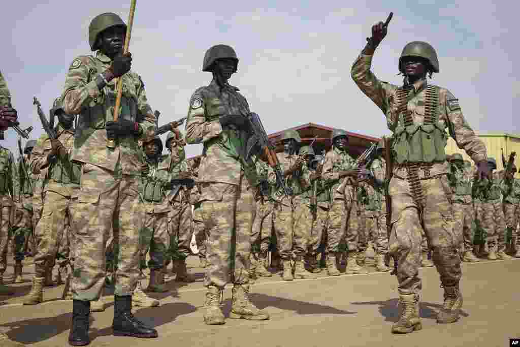 Soldiers from the South Sudan People&#39;s Defense Forces (SSPDF) prepare to board a flight to transport them to eastern Congo, where they are due to operate as part of the East Africa Community Regional Force (EACRF), at the airport in Juba, South Sudan Monday, April 3, 2023.