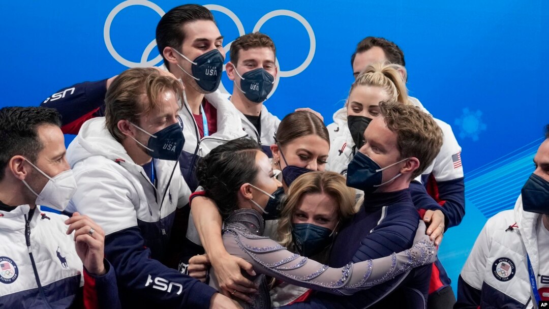 FILE - Madison Chock and Evan Bates, of the United States, reacts after the team ice dance program during the figure skating competition at the 2022 Winter Olympics, Feb. 7, 2022, in Beijing.