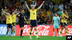 Sweden's Lina Hurtig celebrates with teammates after defeating Australian in the Women's World Cup third place playoff soccer match in Brisbane, Australia, Aug. 19, 2023.