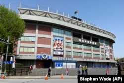 The Meiji Jingu baseball stadium is seen Tuesday, April 11, 2023, in Tokyo. The historic stadium where Babe Ruth played could be demolished, part of a disputed redevelopment plan harshly criticized by environmentalists. (AP Photo/Stephen Wade)